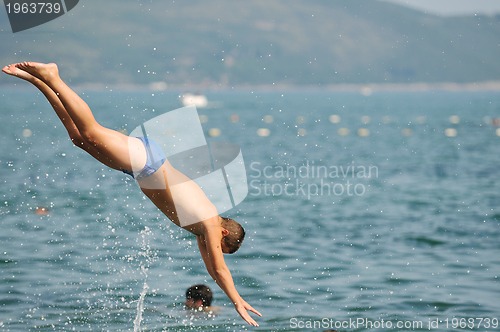 Image of boy jump sea