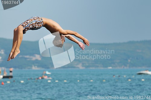 Image of boy jump sea