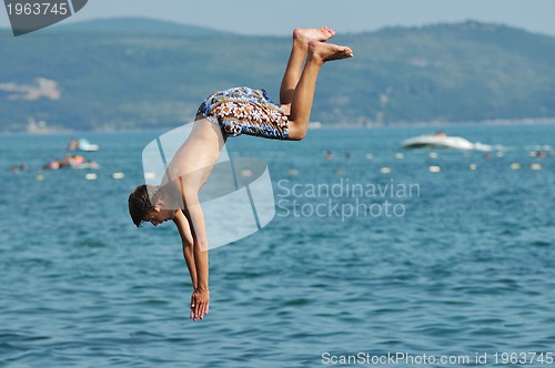 Image of boy jump sea