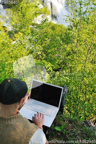 Image of man outdoor laptop