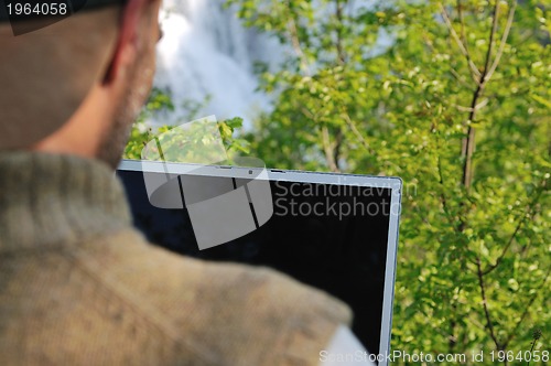 Image of man outdoor laptop