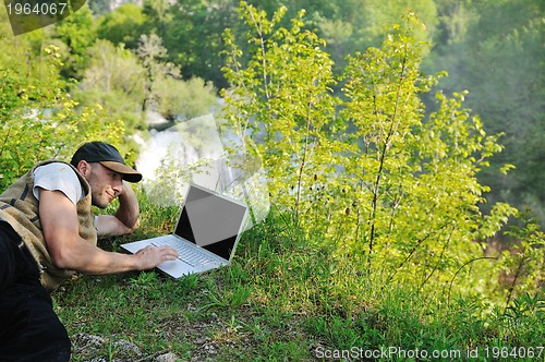 Image of man outdoor laptop