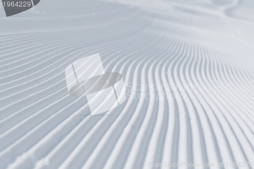 Image of tracks on ski slopes at beautiful sunny  winter day