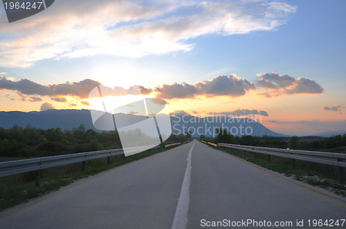 Image of countryroad adventure with beautiful sunset