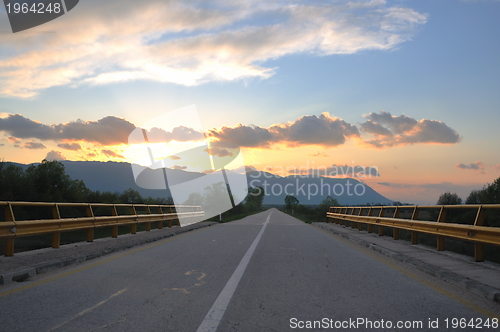 Image of countryroad adventure with beautiful sunset