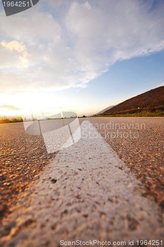 Image of countryroad adventure with beautiful sunset
