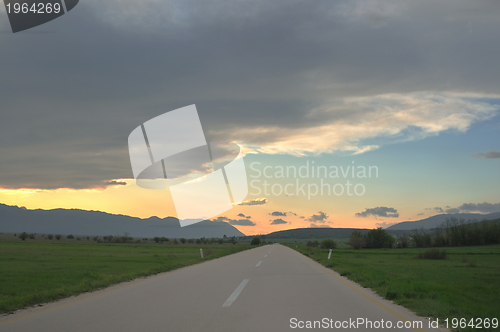 Image of countryroad adventure with beautiful sunset