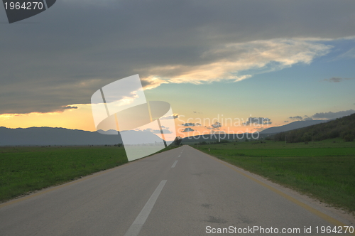 Image of countryroad adventure with beautiful sunset