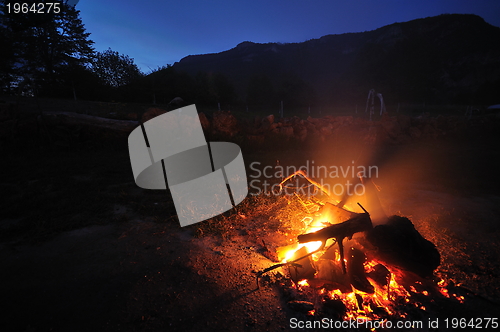 Image of fire with long exposure on camping at night