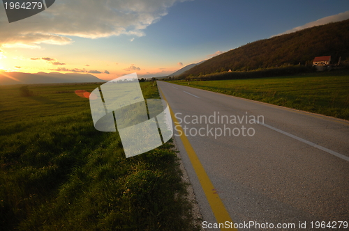 Image of countryroad adventure with beautiful sunset