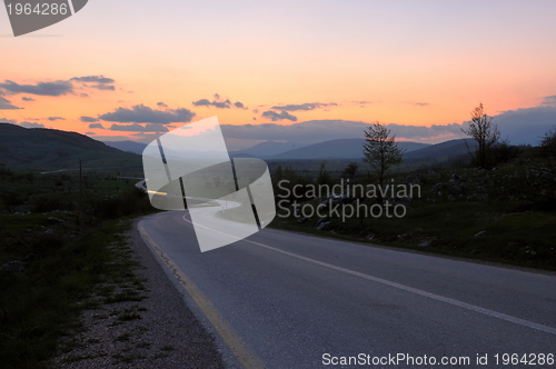 Image of countryroad adventure with beautiful sunset