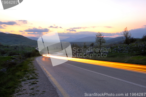 Image of countryroad adventure with beautiful sunset