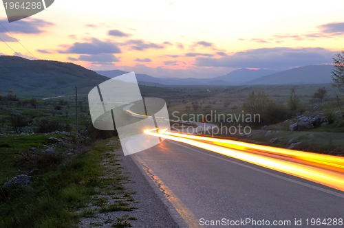 Image of countryroad adventure with beautiful sunset