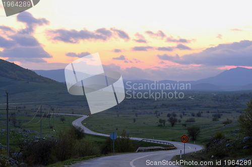 Image of countryroad adventure with beautiful sunset