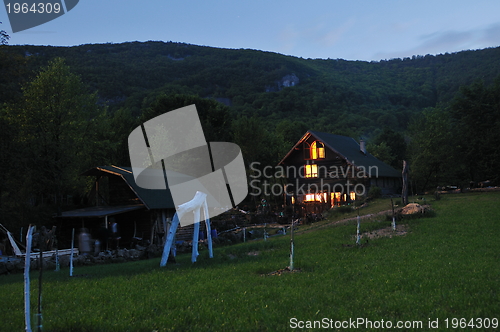 Image of wooden countryside house in night