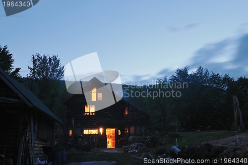 Image of wooden countryside house in night