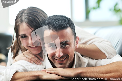 Image of happy young couple relax at home