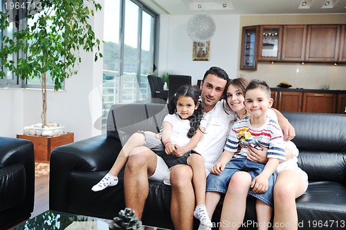 Image of young family at home