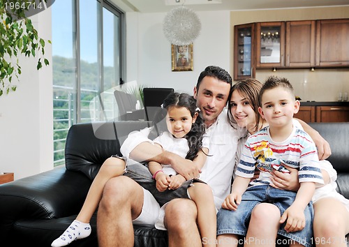 Image of young family at home