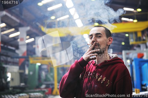 Image of industry worker smoke cigarette