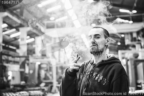 Image of industry worker smoke cigarette