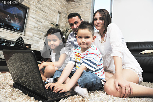 Image of young family at home