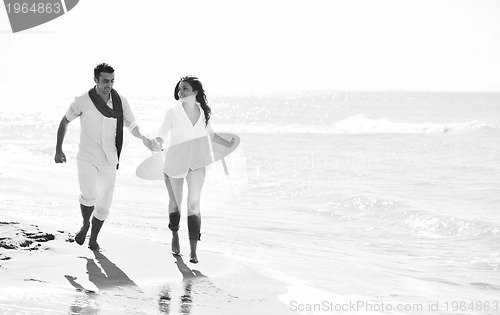 Image of happy young couple have fun at beautiful beach