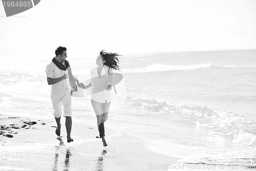 Image of happy young couple have fun at beautiful beach