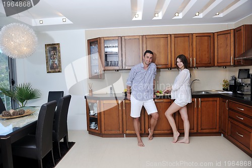 Image of happy young couple have fun in modern kitchen