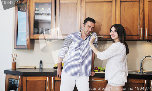 Image of happy young couple have fun in modern kitchen