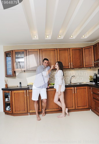 Image of happy young couple have fun in modern kitchen