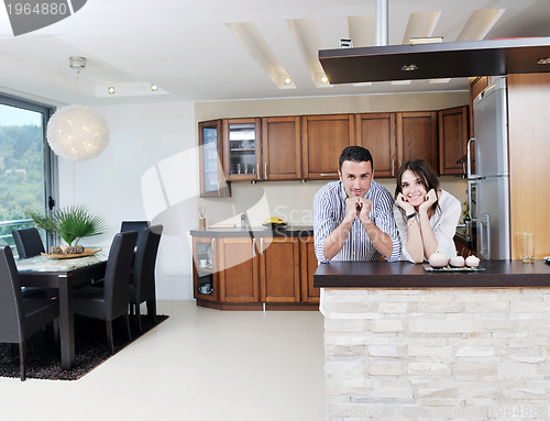 Image of happy young couple have fun in modern kitchen
