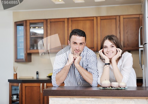 Image of happy young couple have fun in modern kitchen