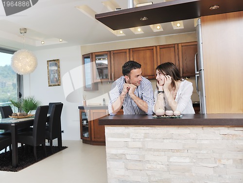 Image of happy young couple have fun in modern kitchen