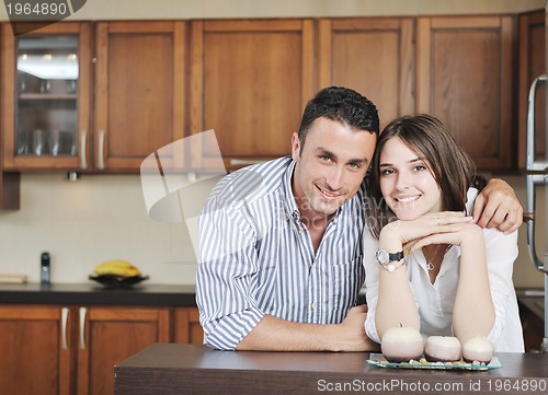 Image of happy young couple have fun in modern kitchen