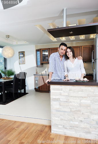 Image of happy young couple have fun in modern kitchen