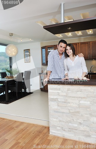 Image of happy young couple have fun in modern kitchen