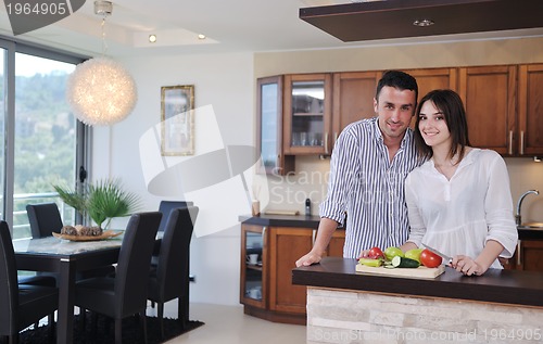 Image of happy young couple have fun in modern kitchen