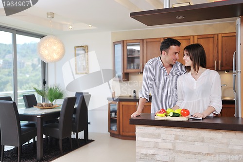 Image of happy young couple have fun in modern kitchen