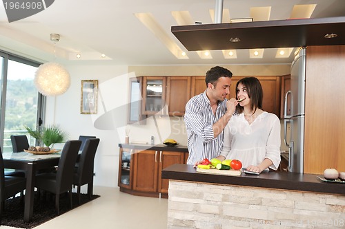 Image of happy young couple have fun in modern kitchen