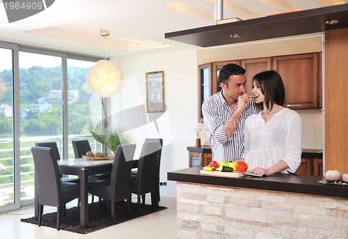 Image of happy young couple have fun in modern kitchen