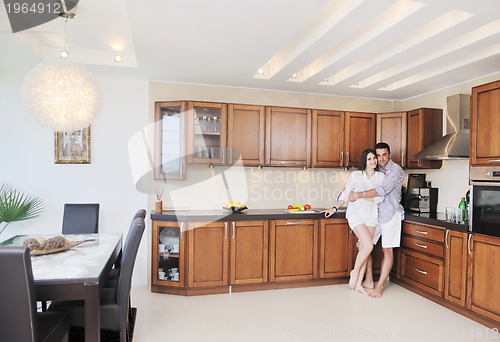 Image of happy young couple have fun in modern kitchen