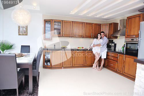 Image of happy young couple have fun in modern kitchen