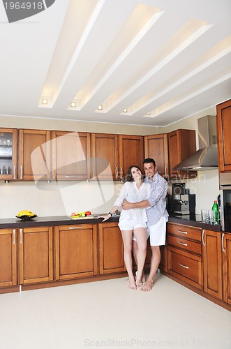 Image of happy young couple have fun in modern kitchen