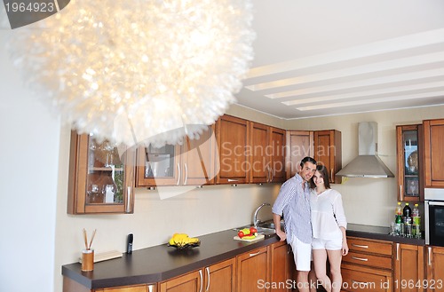 Image of happy young couple have fun in modern kitchen