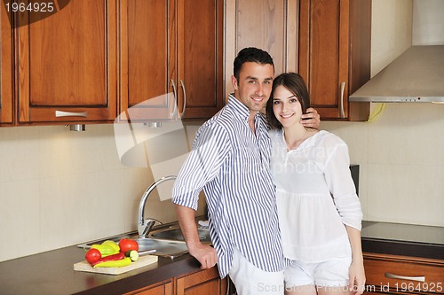 Image of happy young couple have fun in modern kitchen