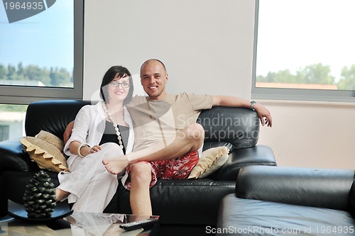 Image of happy young couple relax at home