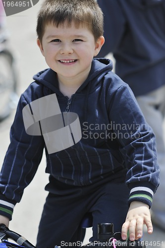 Image of little boy ride bicycle