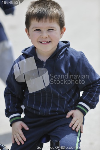 Image of little boy ride bicycle