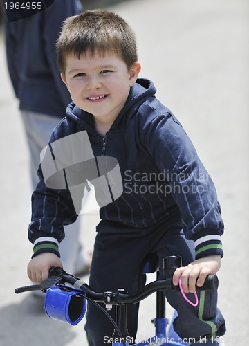 Image of little boy ride bicycle